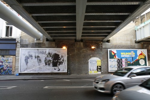 billboard under bridge on old street, london